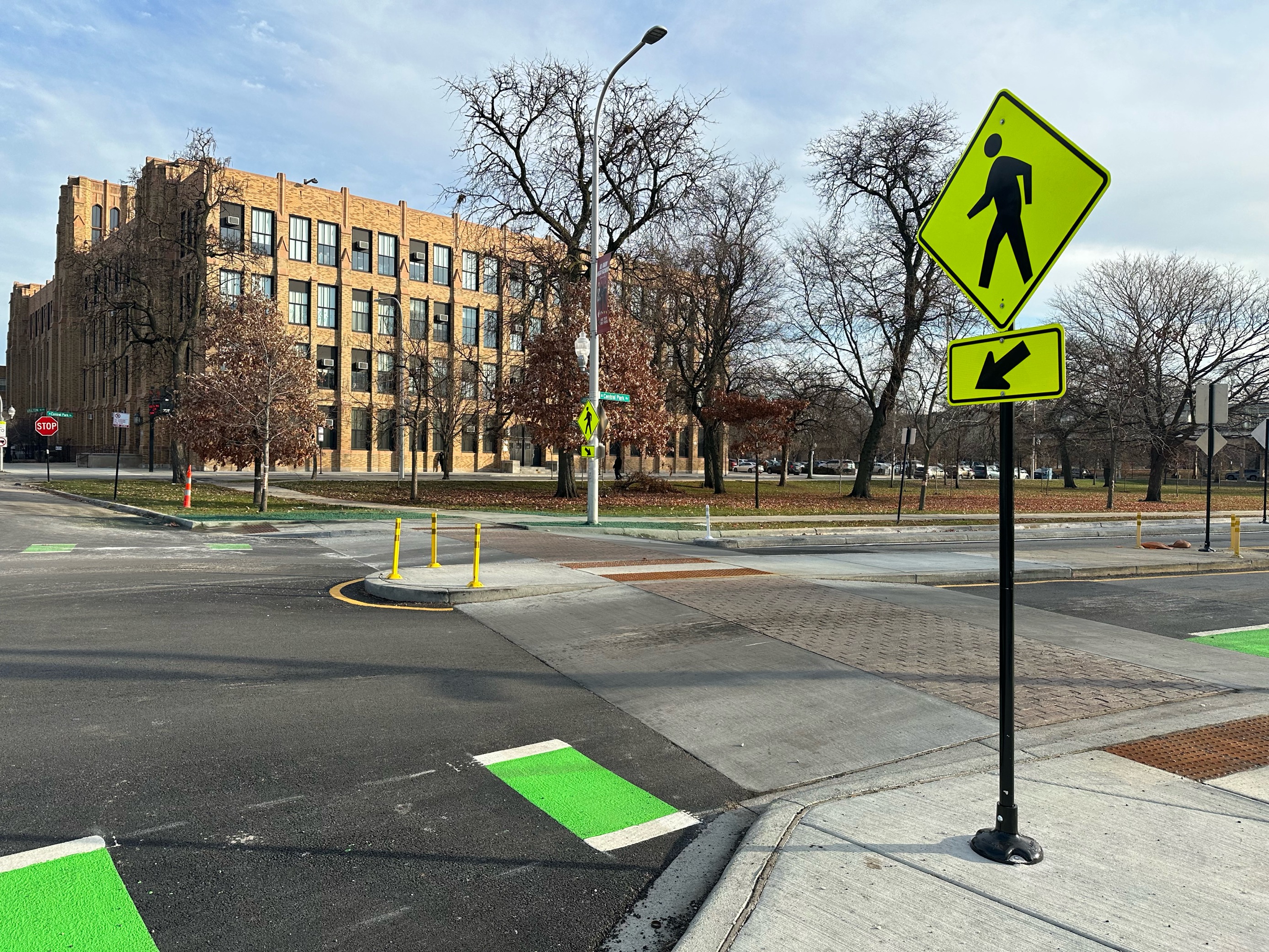 Photo of a raised crosswalk and pedestrian refuge island